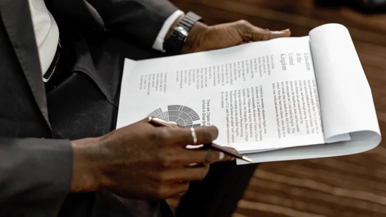 Business professional reviewing a printed financial report