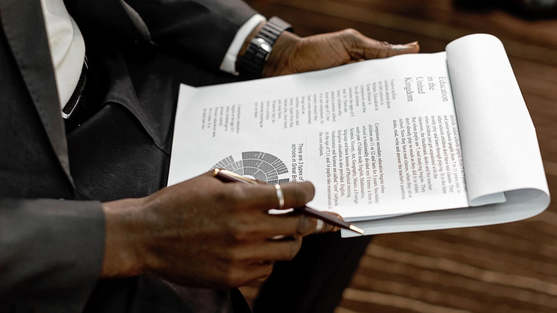 Business professional reviewing a printed financial report