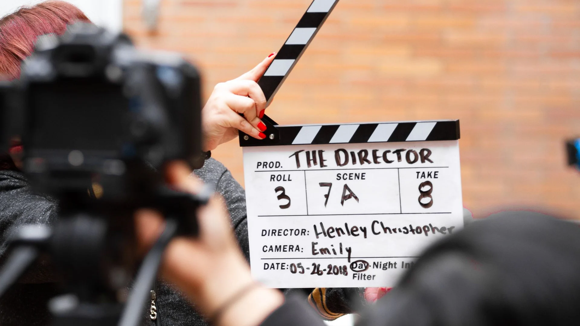 Film clapperboard and camera being used on a production set
