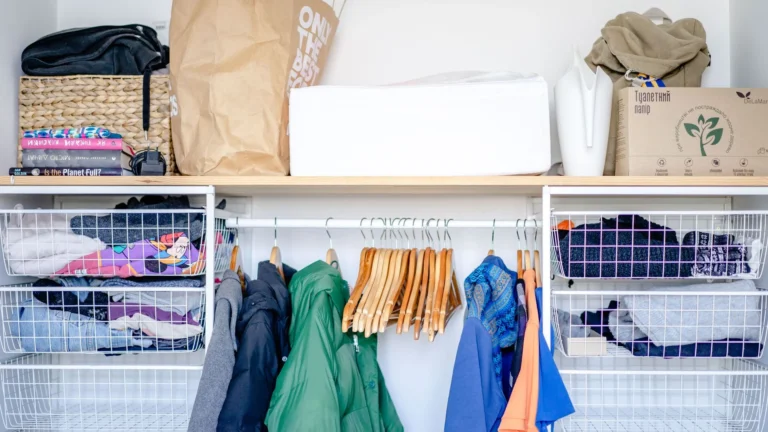 Organised open wardrobe with clothing and storage baskets