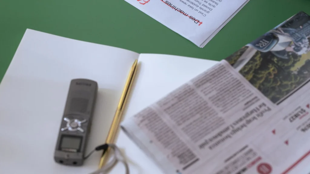 Editor checking printed documents and making corrections